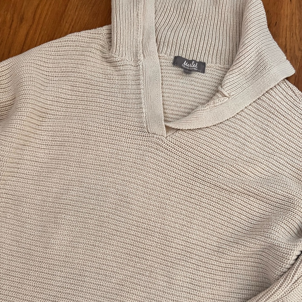 Tan collared sweater.